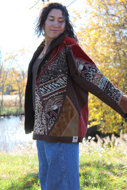 Vintage brown jacket featuring mixed animal prints and a stylish, unique vibe.