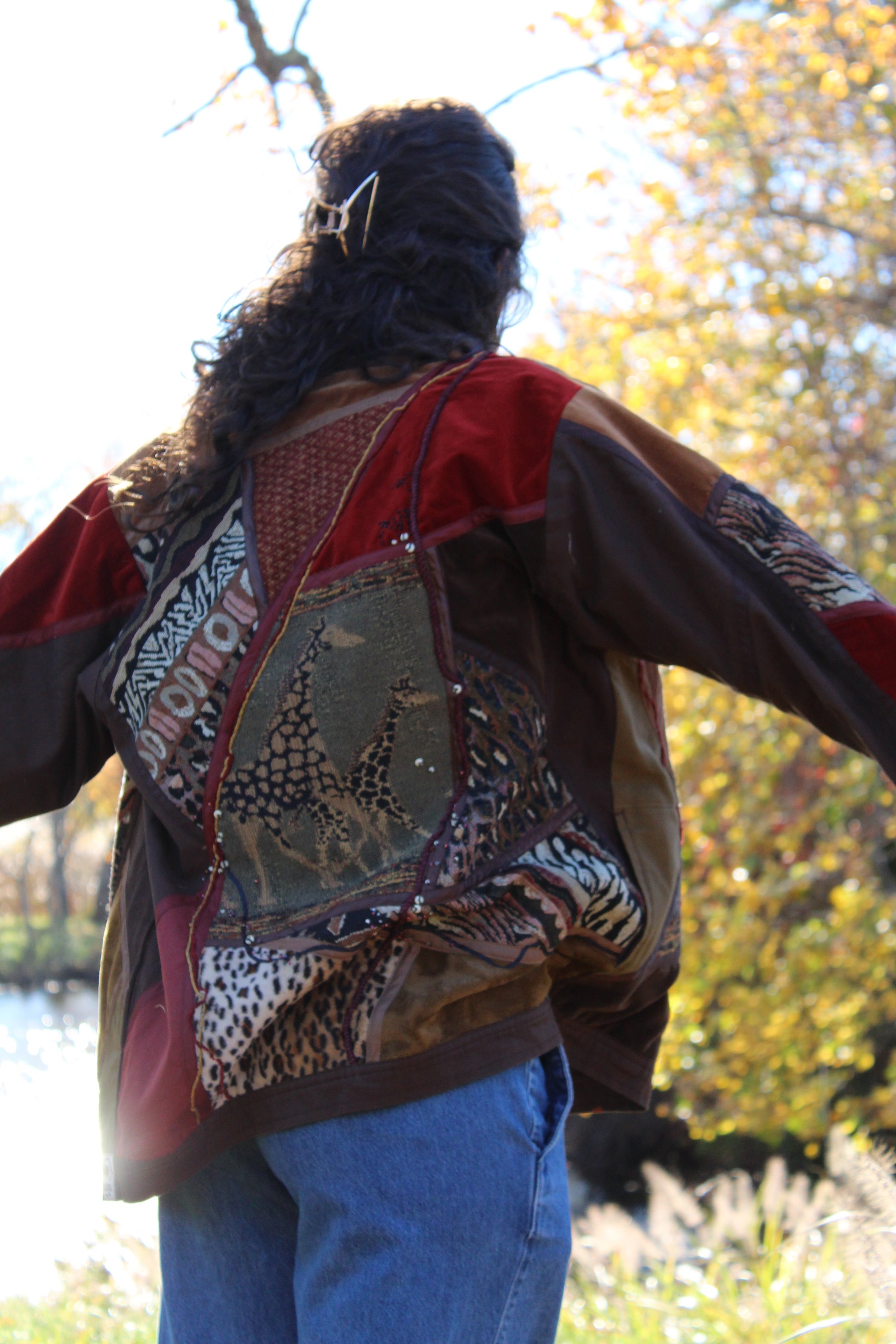 Brown patterned jacket with eye-catching animal motifs and a trendy fit.