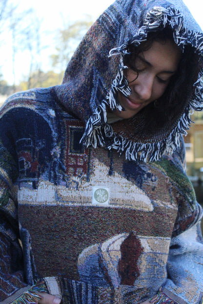 Handcrafted hoodie made from a vintage blanket, featuring fringe and scenic patterns.