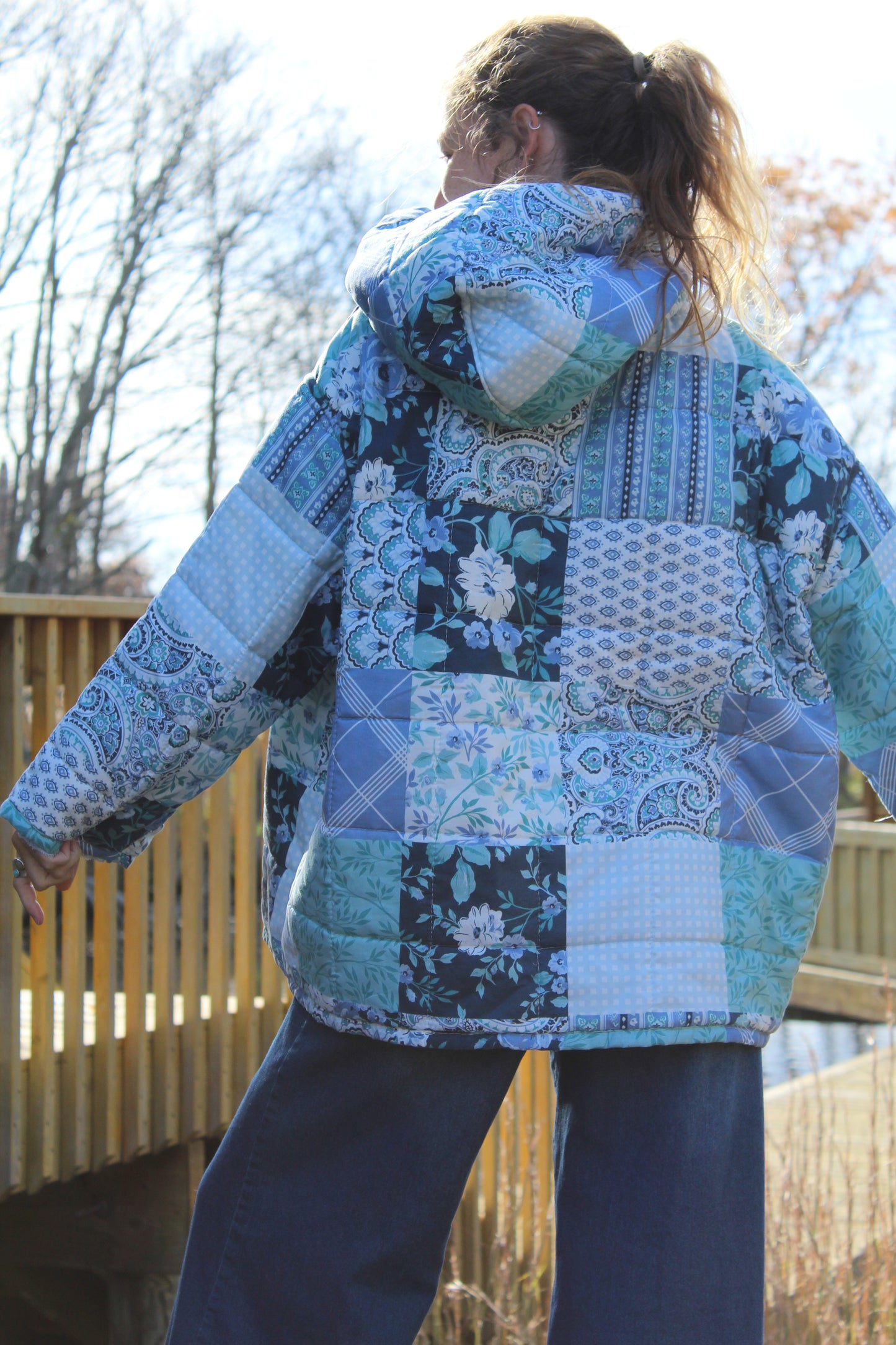 Sustainable fashion piece — blue upcycled hoodie crafted from a vintage patchwork quilt