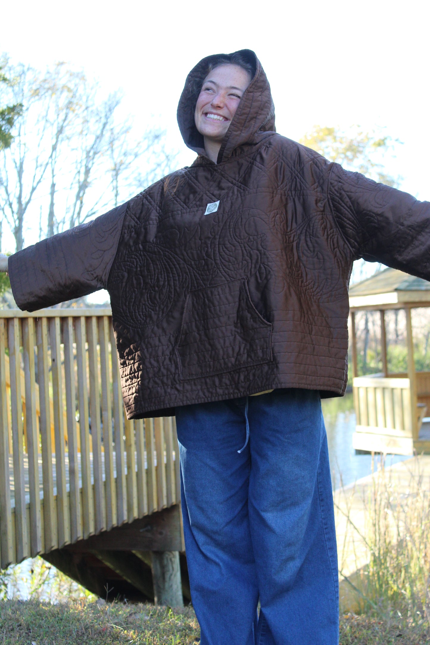 Brown quilted hoodie with delicate silky flower embroidery on the front and sleeves
