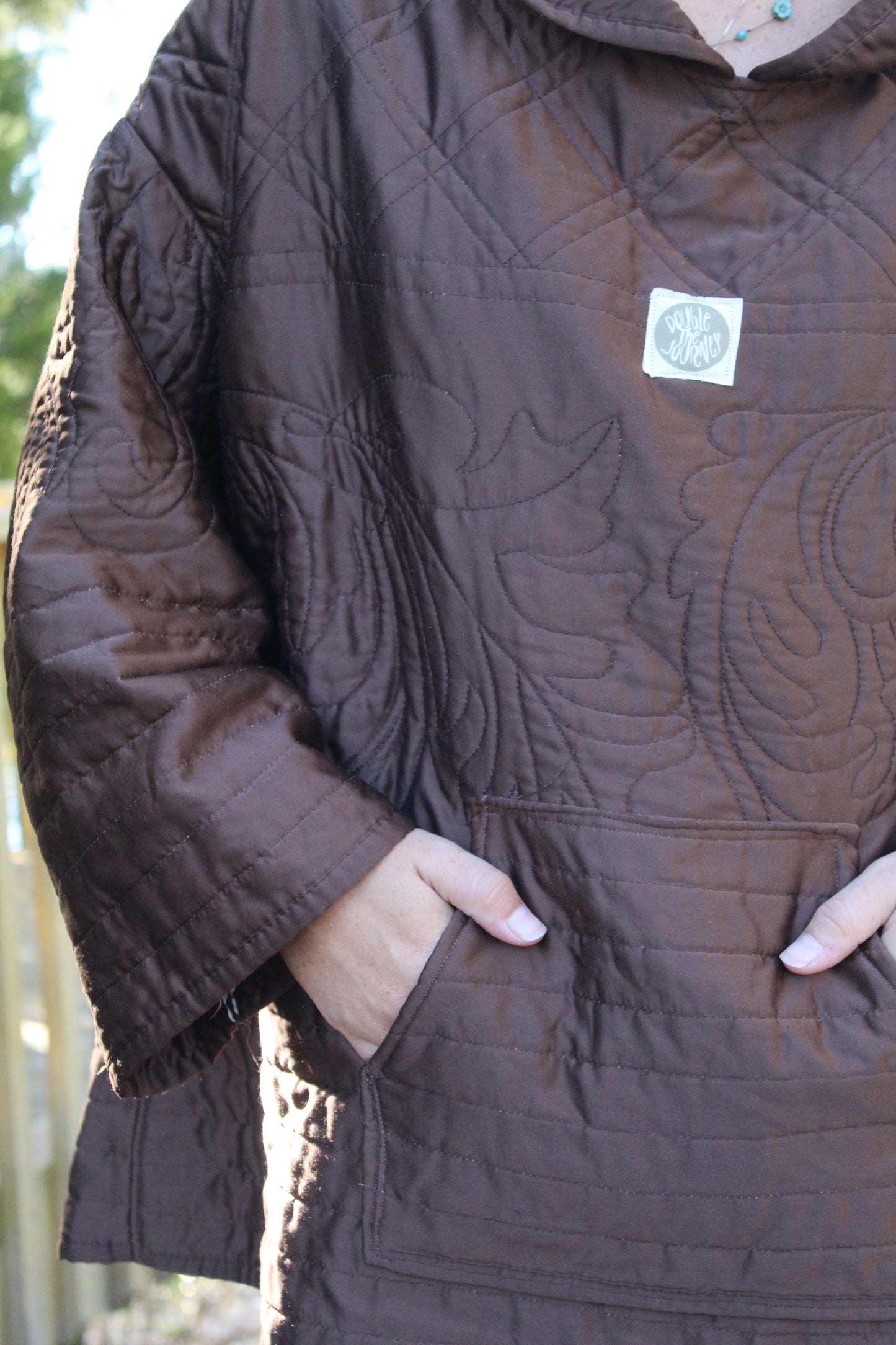 Warm brown quilted hoodie with dainty embroidered flowers for a cottagecore feel