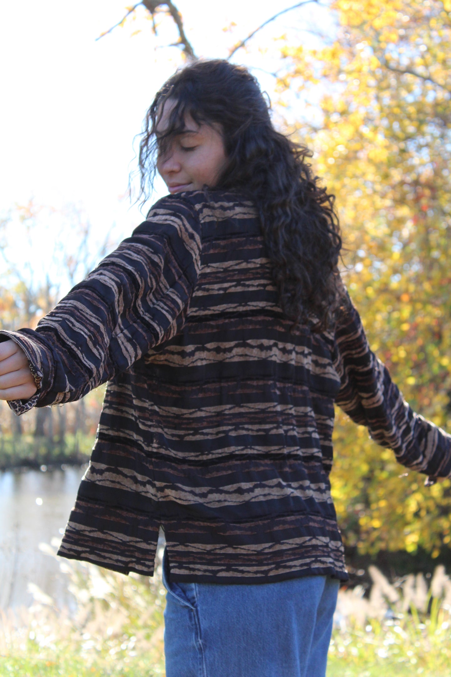 Close-up of a brown animal print jacket showing zebra and cheetah detailing.