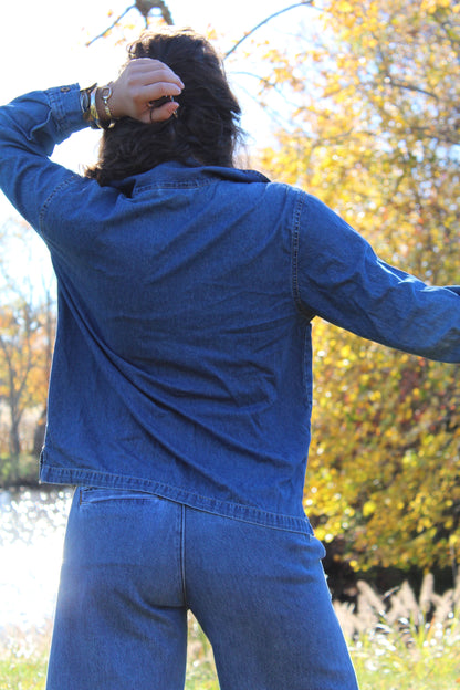 Vintage-inspired lightweight denim jacket with decorative embroidery and zip closure.