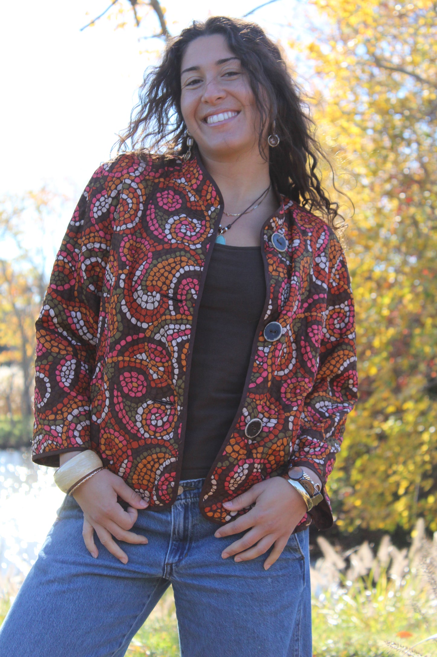 Lightweight quilted button-up featuring bold orange and red polka dots.