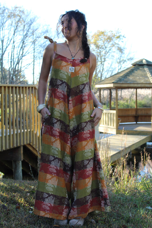 Upcycled jumpsuit made from a vintage tablecloth, featuring cozy fall patterns and textures.