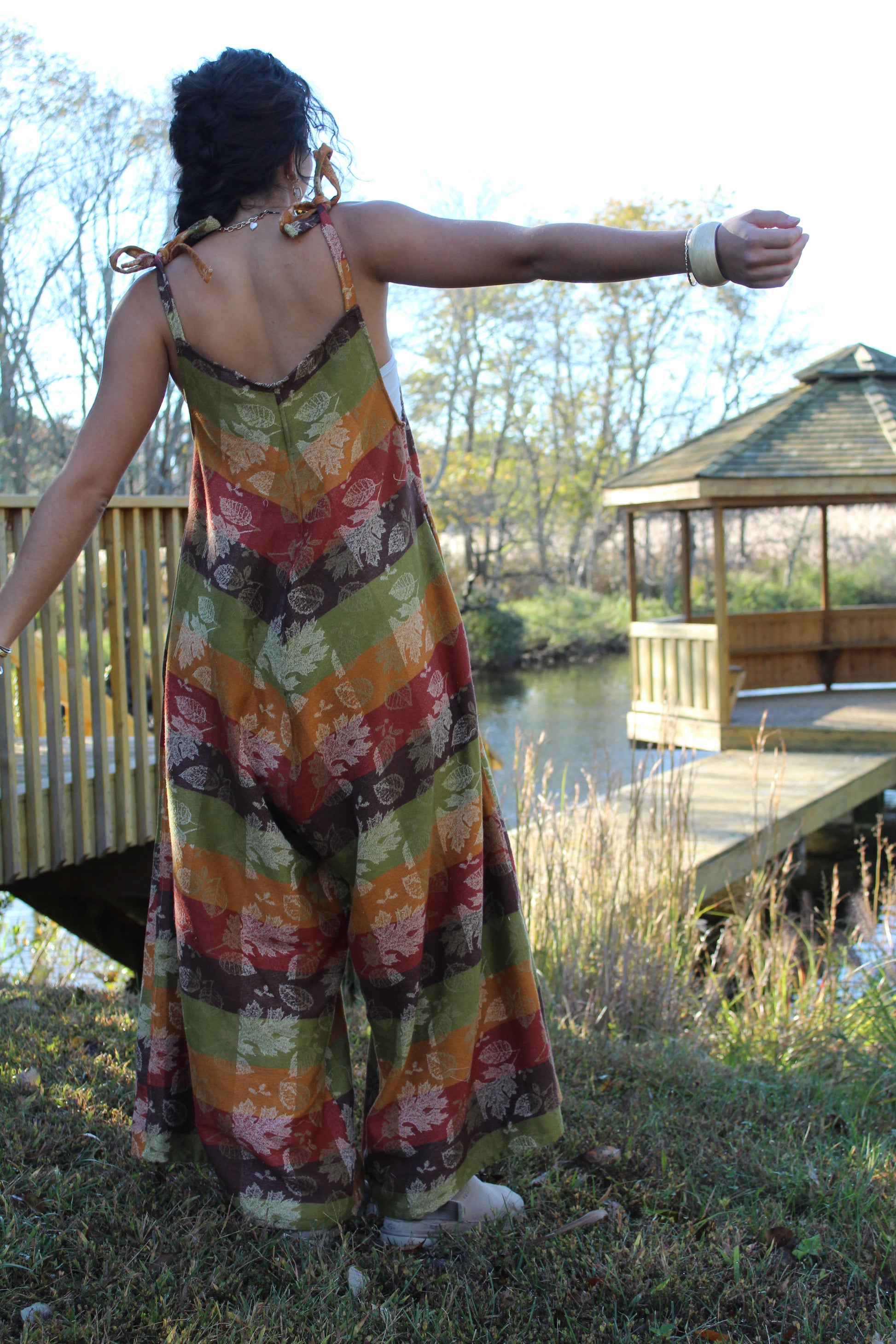 One-of-a-kind fall jumpsuit sewn from a vintage tablecloth, blending rustic and chic styles.