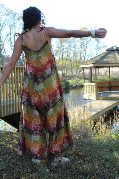 One-of-a-kind fall jumpsuit sewn from a vintage tablecloth, blending rustic and chic styles.