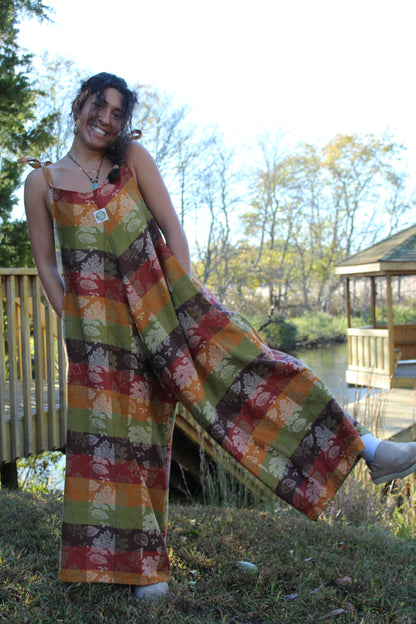Handmade fall jumpsuit crafted from a vintage floral tablecloth with warm autumn tones.