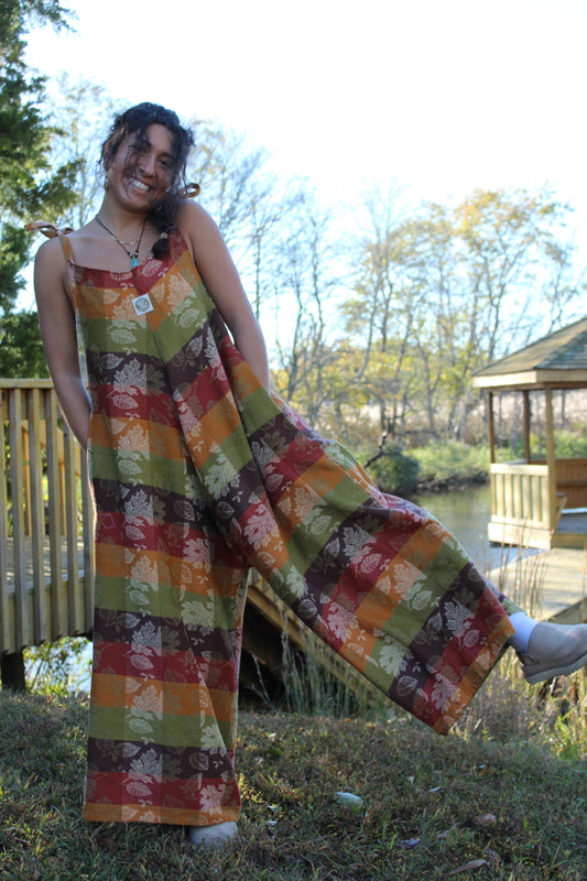 Handmade fall jumpsuit crafted from a vintage floral tablecloth with warm autumn tones.