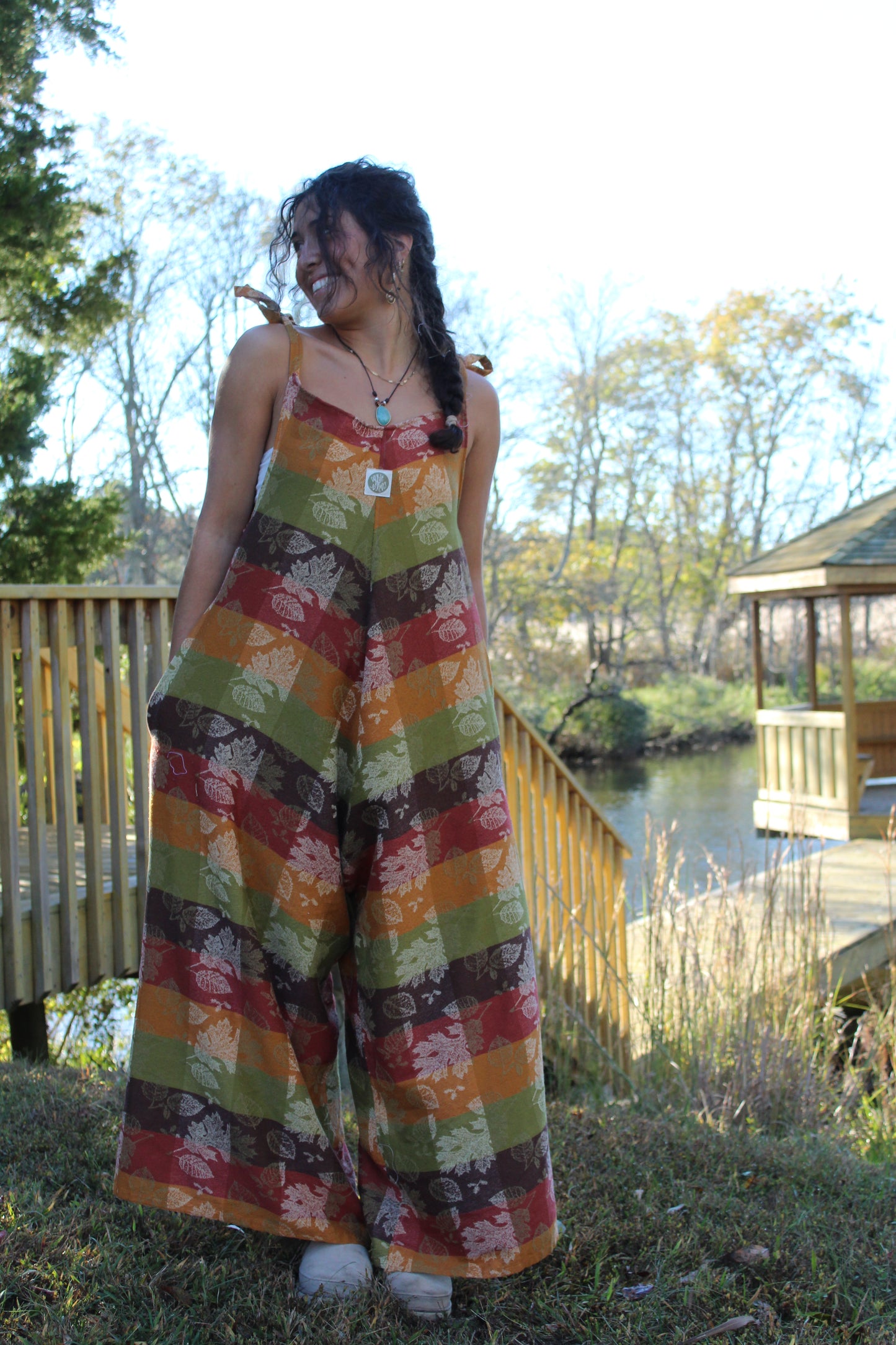 Unique upcycled jumpsuit made from a patterned vintage tablecloth, perfect for fall layering
