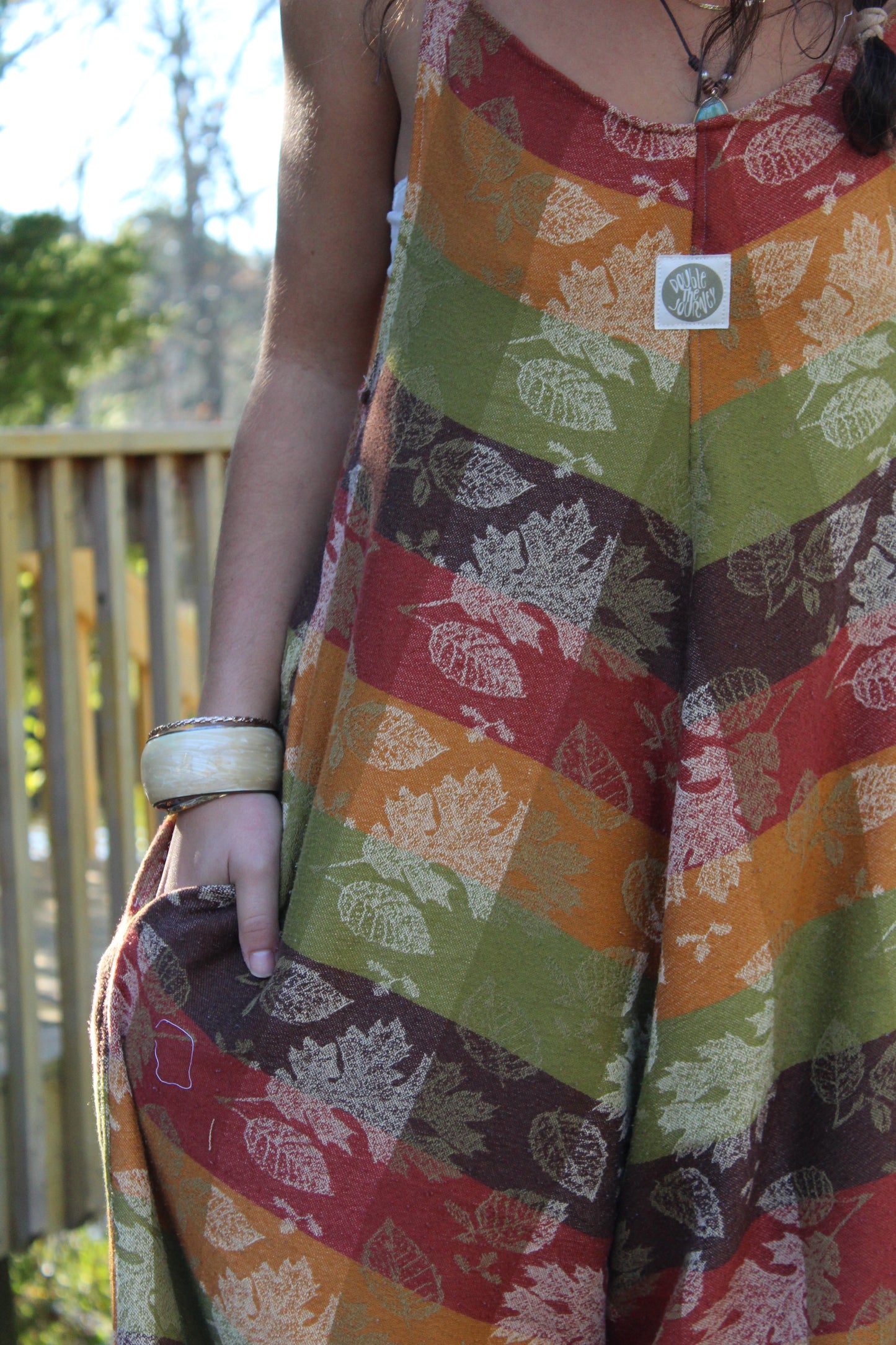 Vintage tablecloth turned into a handmade jumpsuit with earthy fall colors and charm