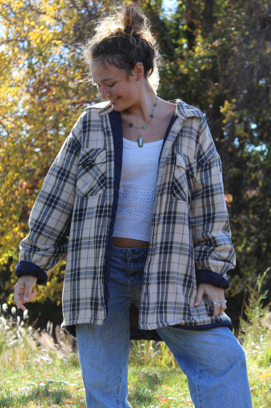 Super oversized tan and navy flannel with a relaxed, cozy fit.