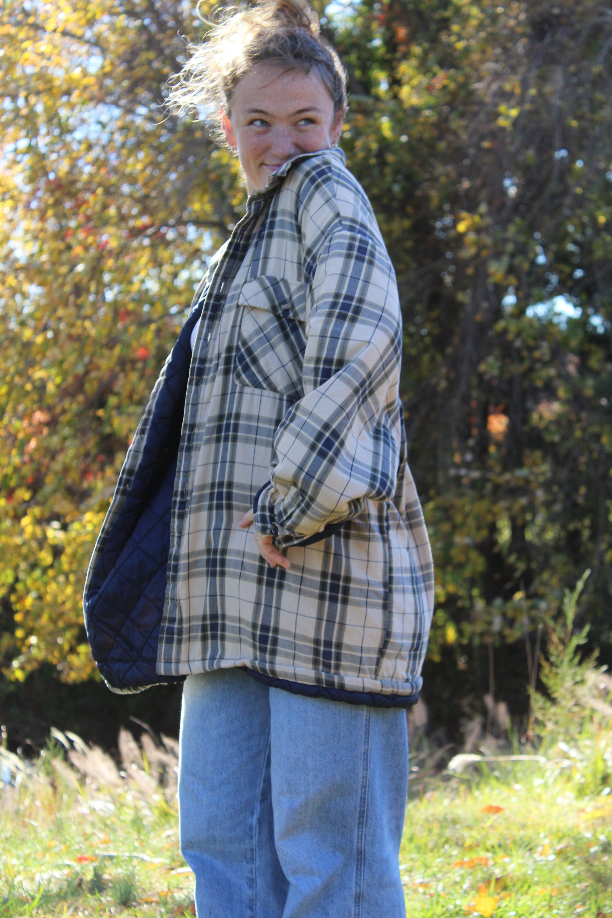 Tan and navy plaid flannel shirt in an extra-oversized silhouette.