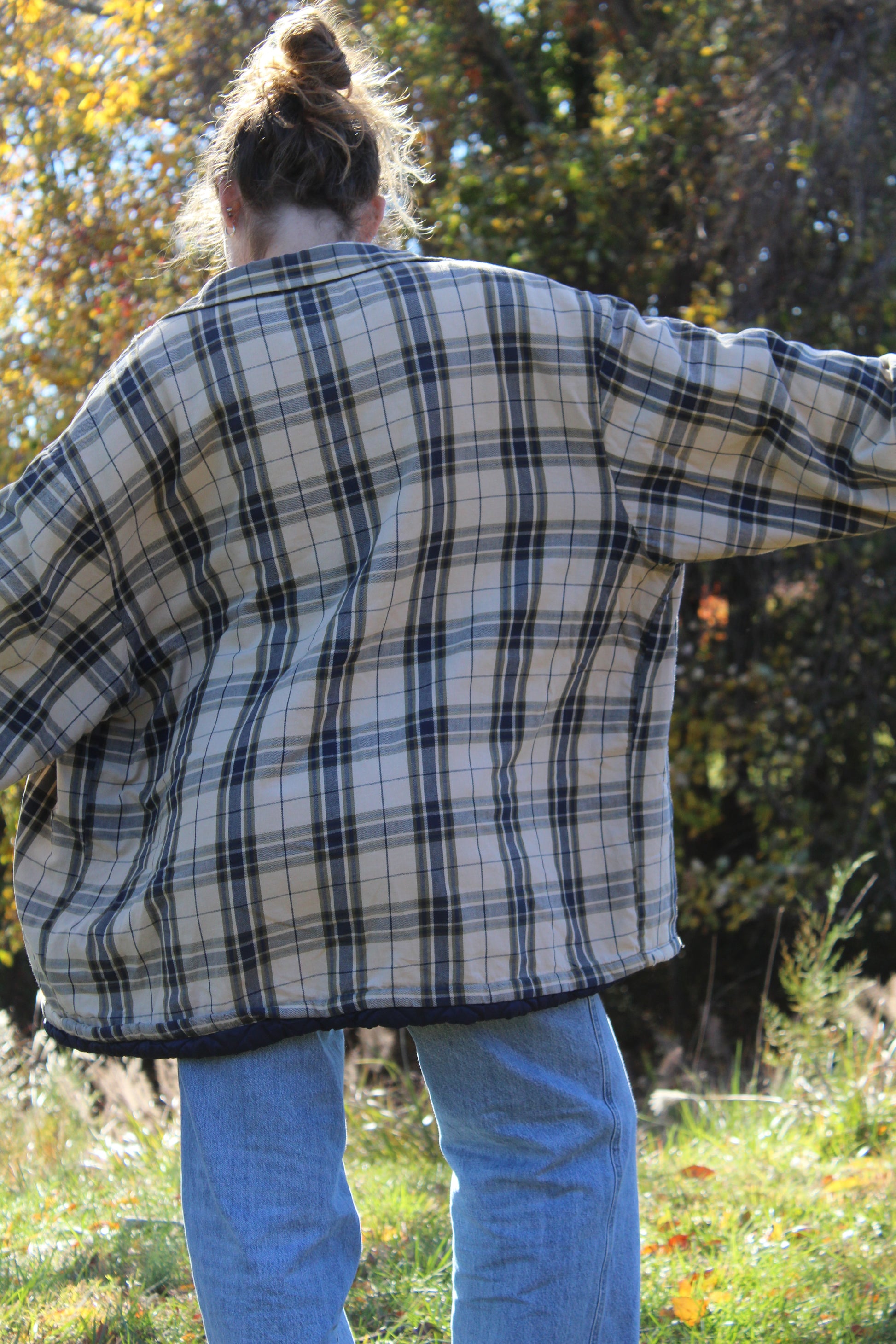 Soft tan and navy plaid flannel designed with an ultra-roomy shape.