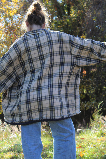 Soft tan and navy plaid flannel designed with an ultra-roomy shape.