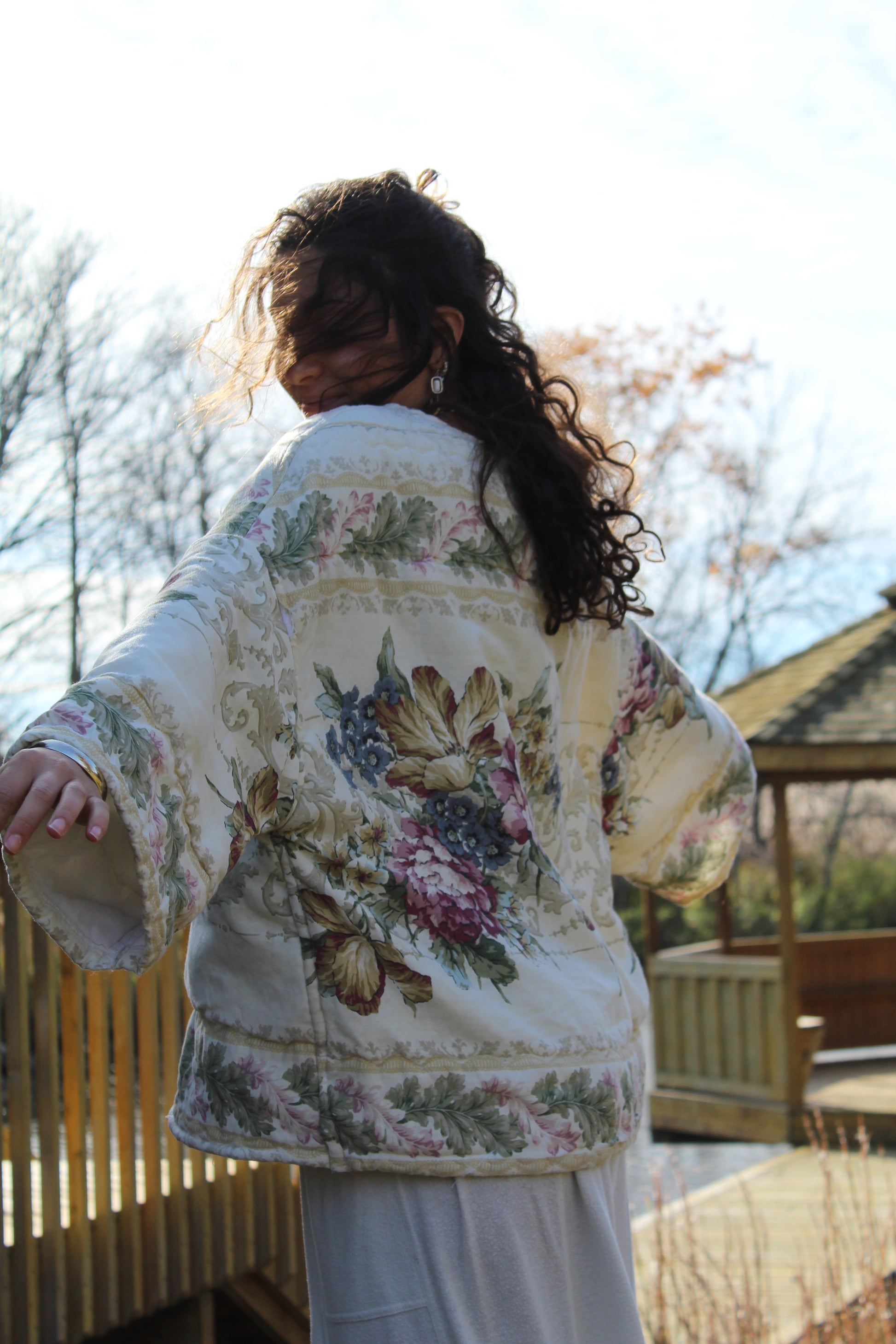 One-of-a-kind handmade crewneck featuring pastel floral print from a vintage comforter.