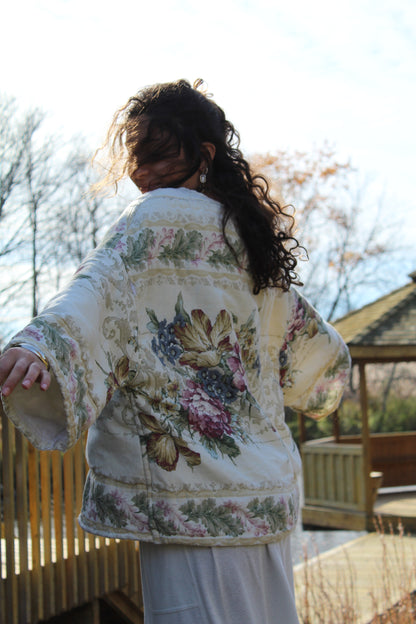 One-of-a-kind handmade crewneck featuring pastel floral print from a vintage comforter.