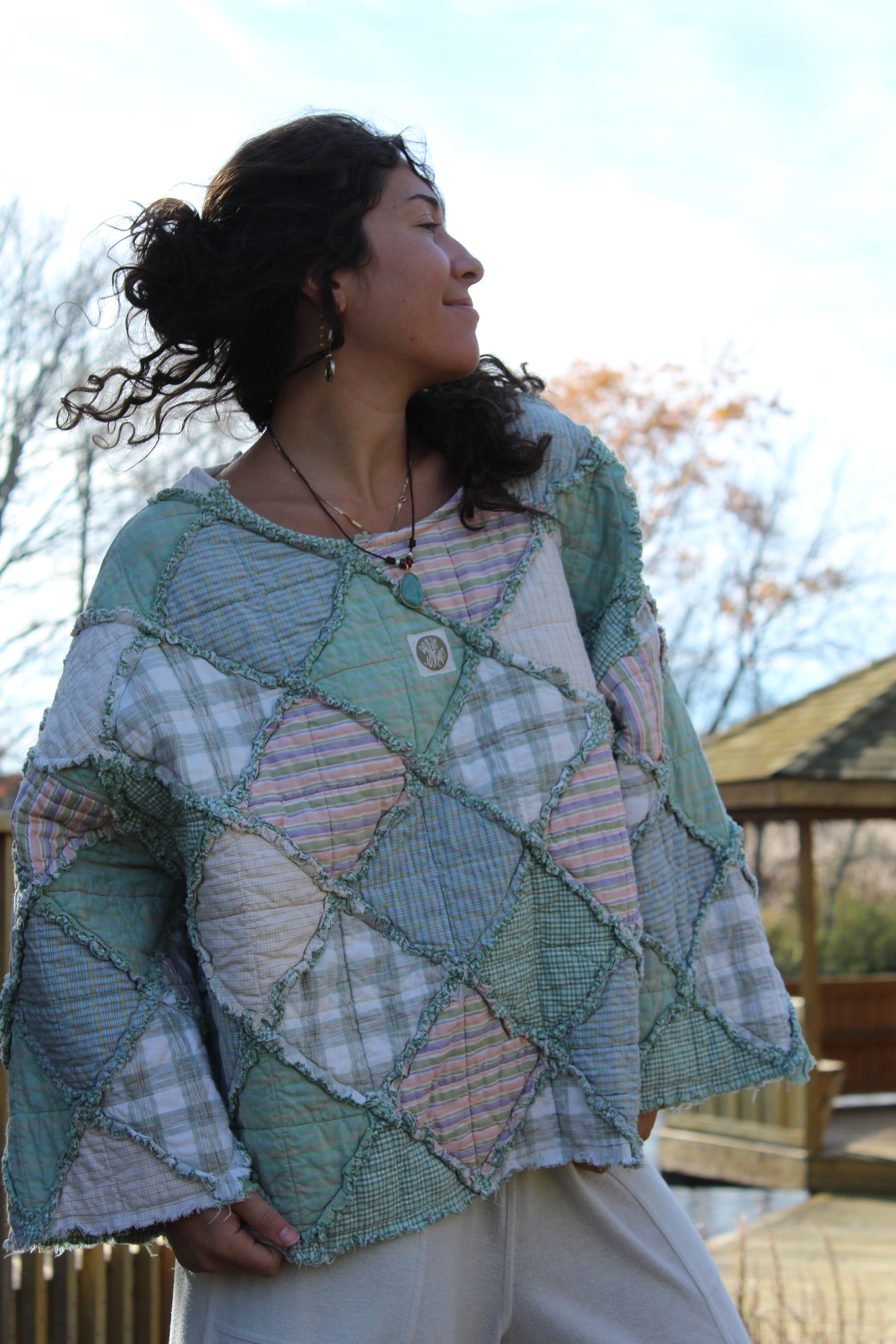 Handmade green patchwork crewneck crafted from vintage quilt fabric.