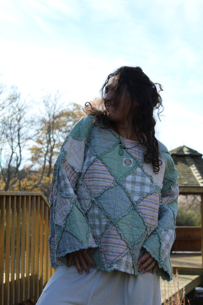 Upcycled crewneck featuring gorgeous green tones and mixed patchwork patterns.