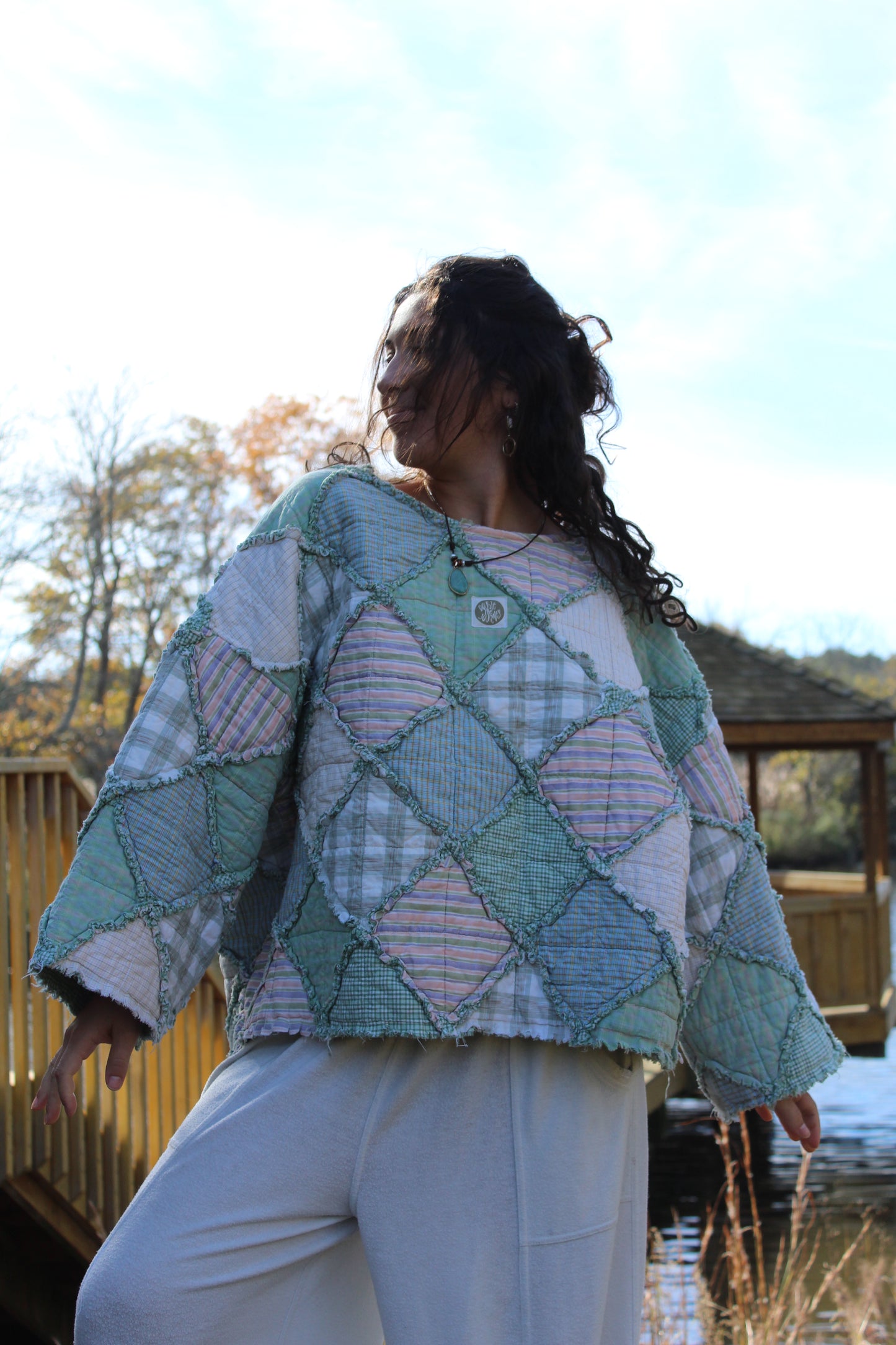 Vintage-inspired handmade crewneck in soft green patchwork fabric