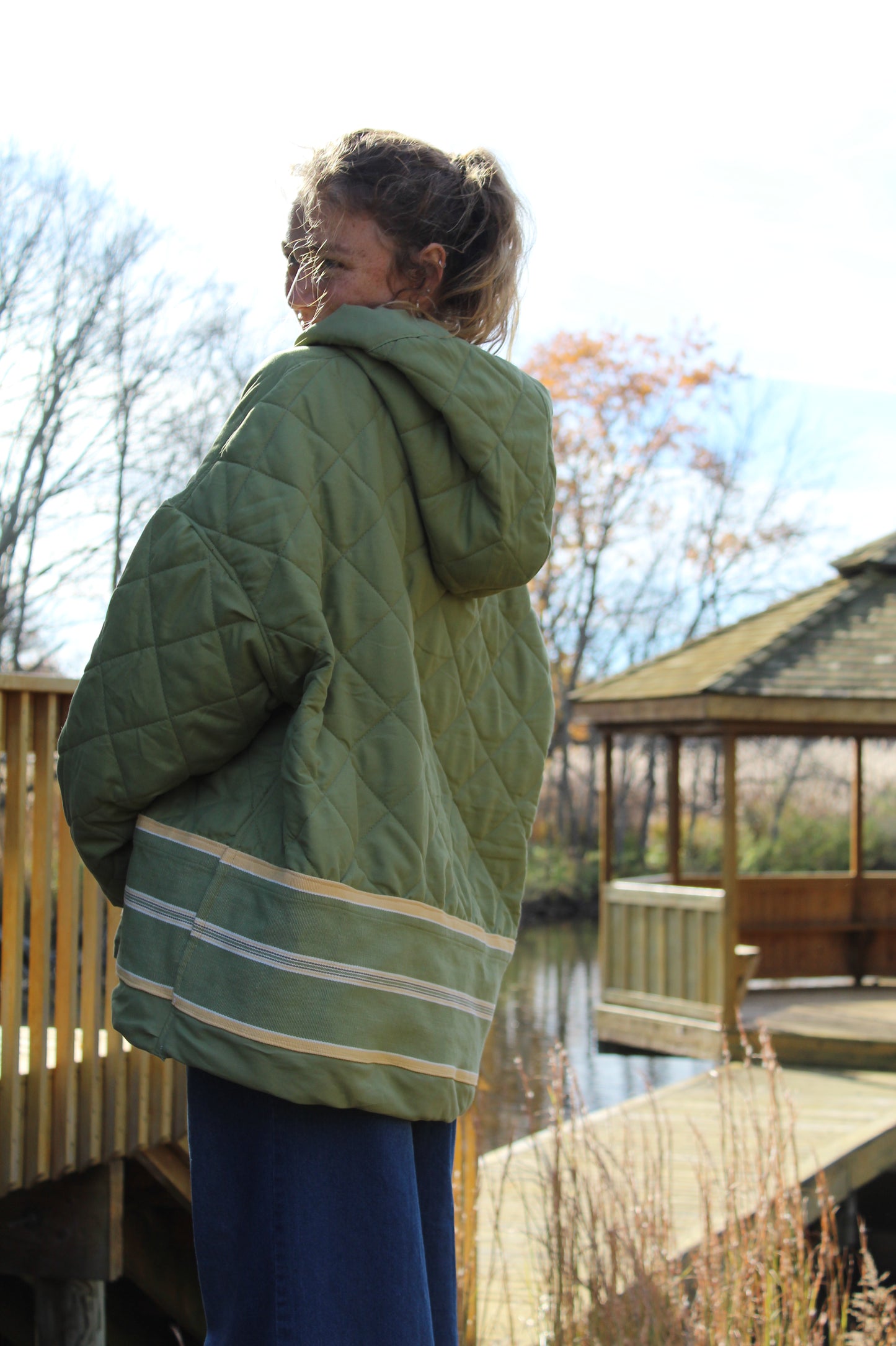 “One-of-a-kind handmade green hoodie with sporty yellow stripe design.”