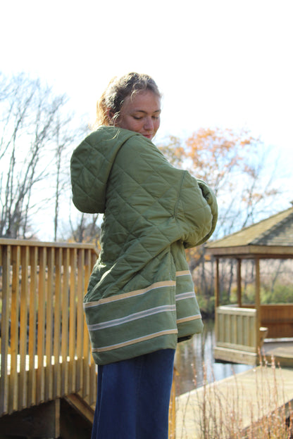 “Men’s large green hoodie made from repurposed fabric with yellow stripe detail.”