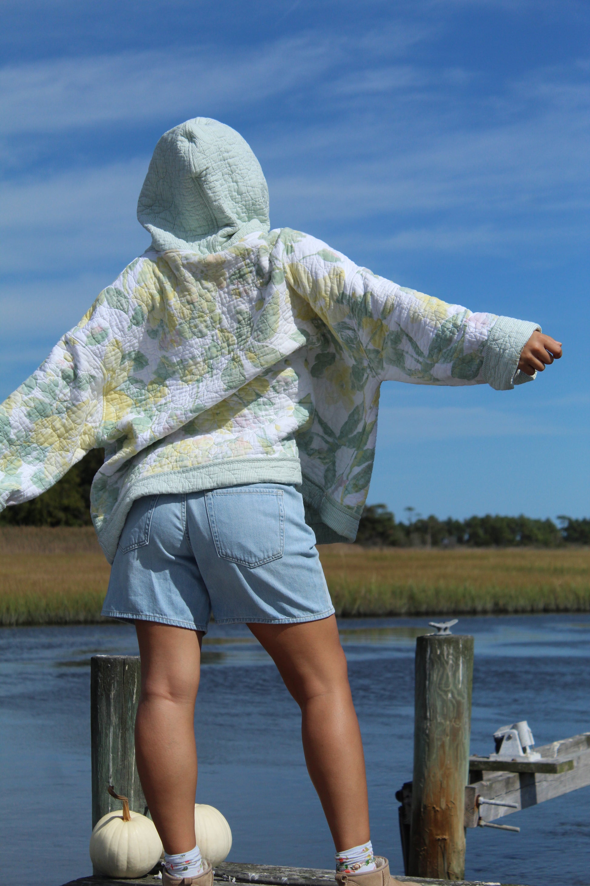 back view of yellow and green quilted hoodie