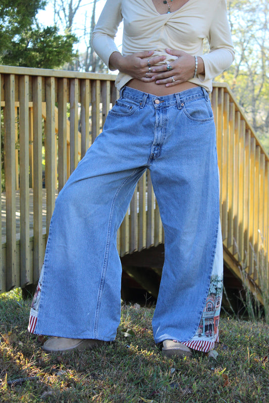 Upcycled vintage Levi’s with scenic European tapestry panels along the sides