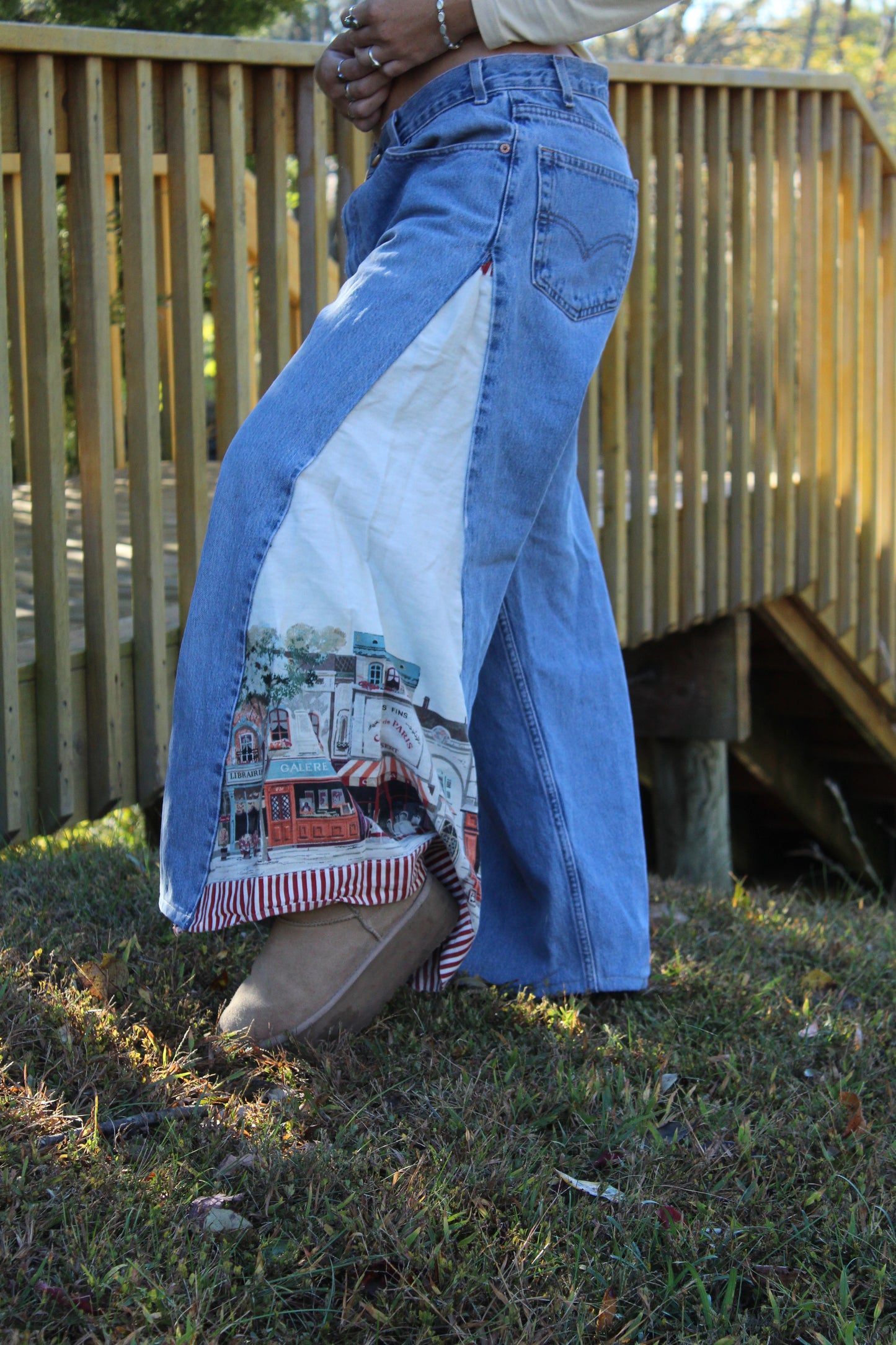 One-of-a-kind vintage Levi’s featuring repurposed fabric side panels with a European art scene