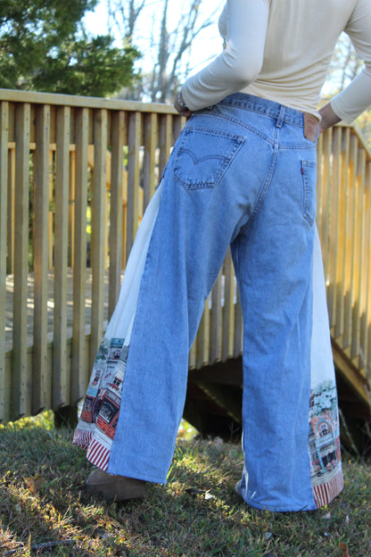 Vintage Levi’s jeans customized with detailed European countryside imagery on the side panels