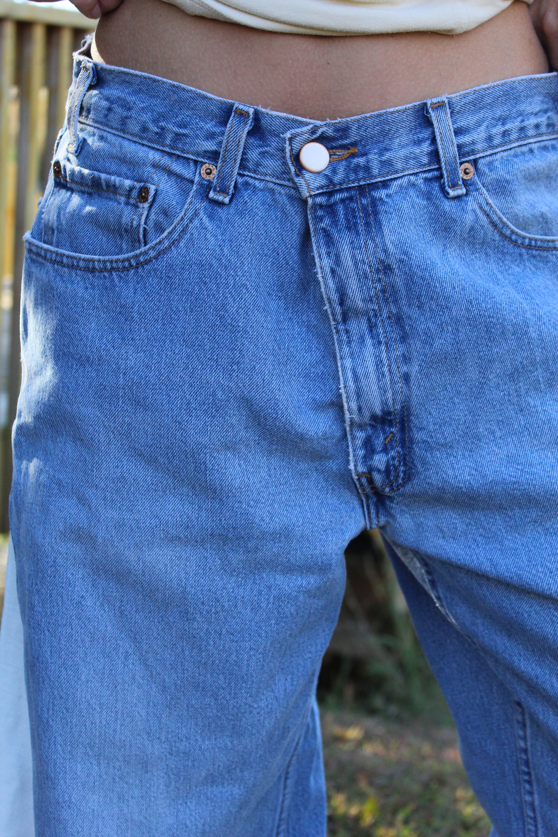 Unique upcycled Levi’s jeans with detailed European art-inspired side panels.