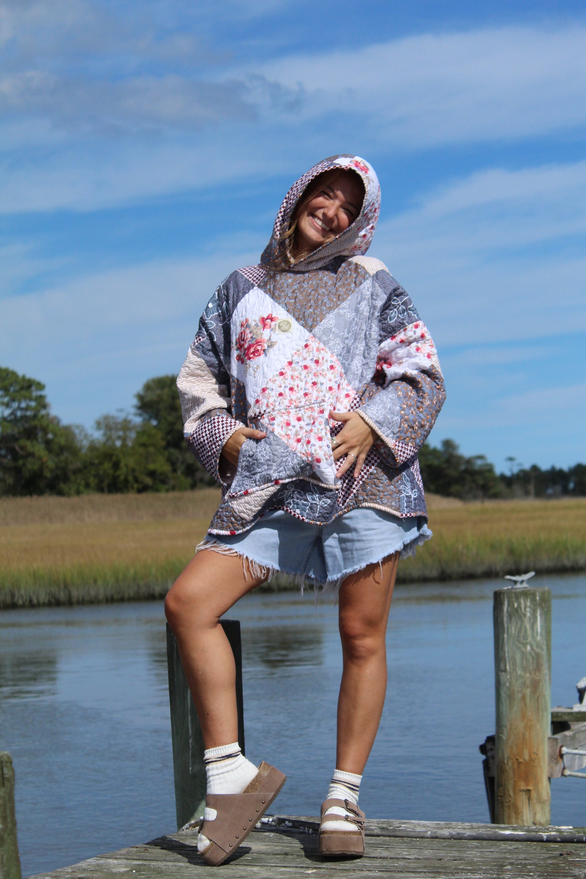 quilted sweatshirt featuring hood up and spacious pocket on front
