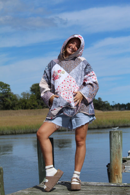 quilted sweatshirt featuring hood up and spacious pocket on front
