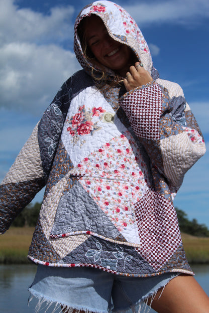 close up of quilted patchwork hoodie with scalloped details
