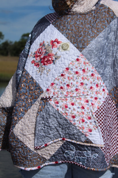 Patchwork quilt with floral patterns and textured fabric
