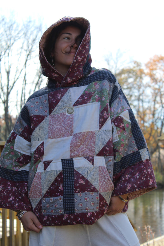 Vintage quilted handmade hoodie featuring dark red and blue patchwork details.
