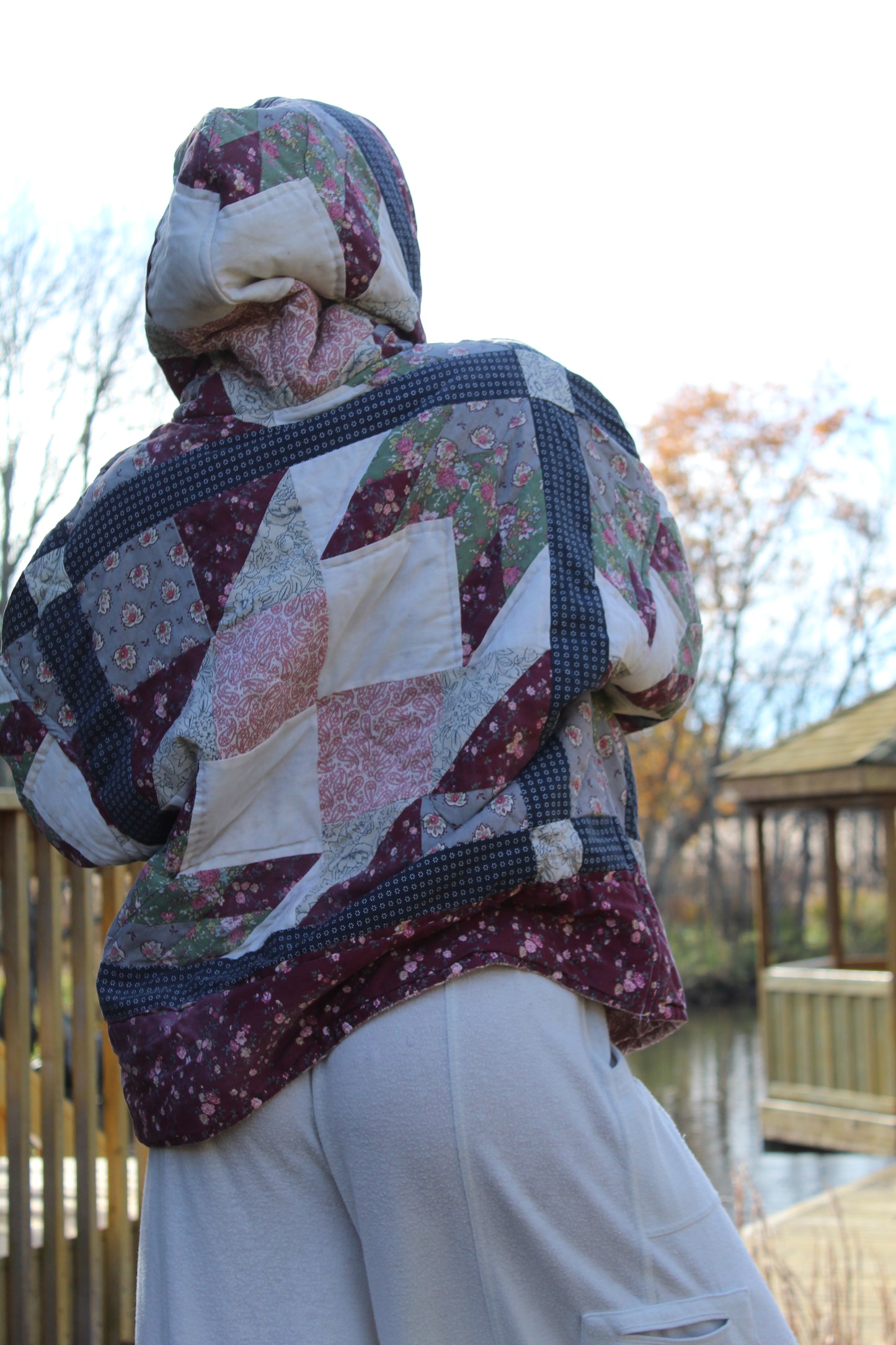 One-of-a-kind quilted hoodie with dark red and blue vintage fabric squares.