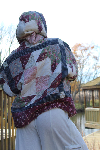One-of-a-kind quilted hoodie with dark red and blue vintage fabric squares.