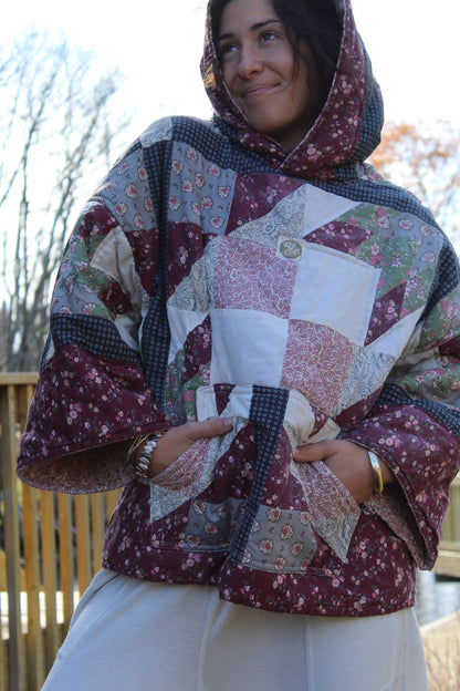 Sustainable upcycled hoodie made from a vintage quilt in dark red and blue tones.