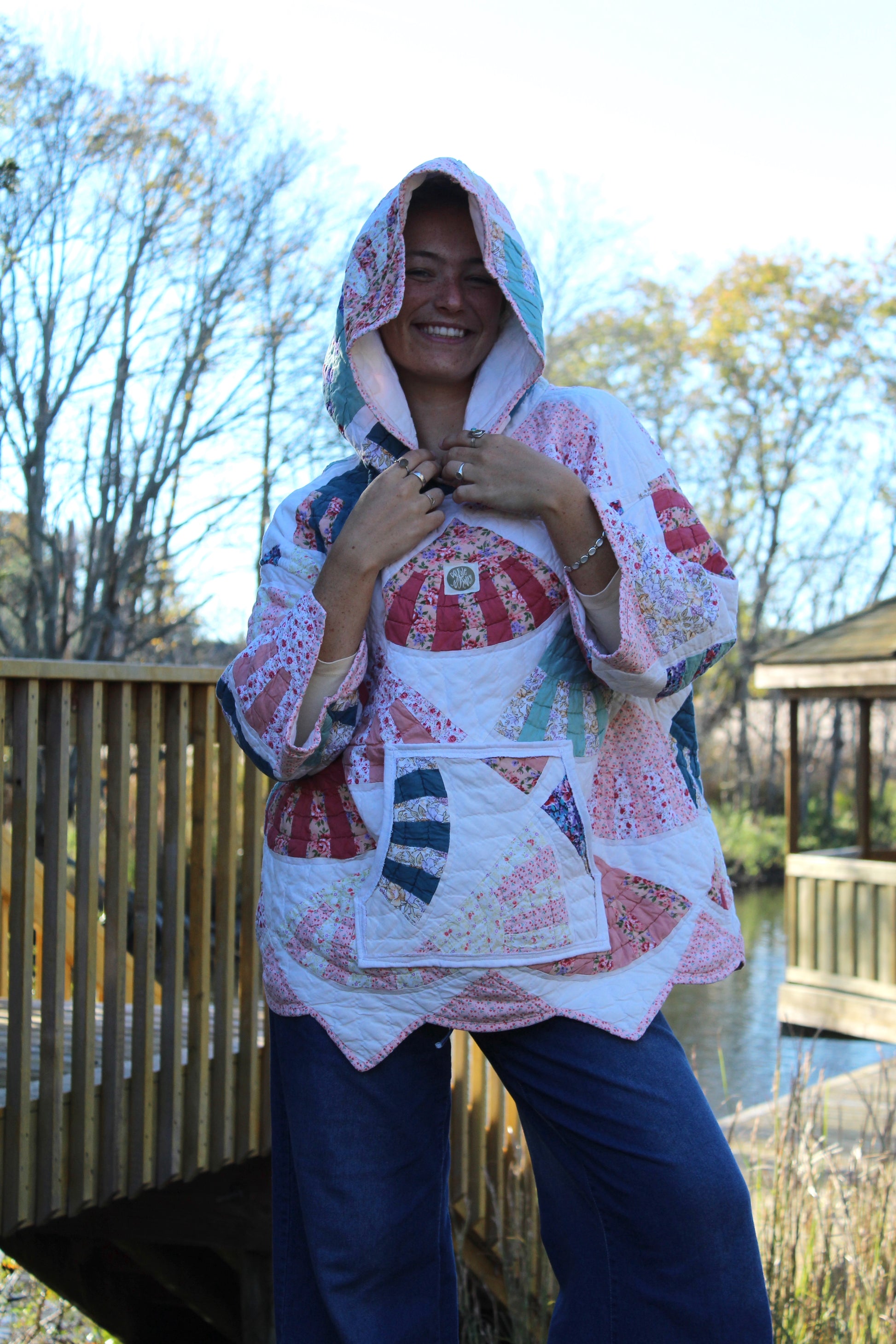 pink quilted hoodie with patterns and pockets