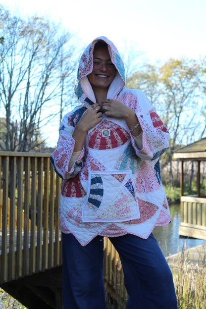 pink quilted hoodie with patterns and pockets