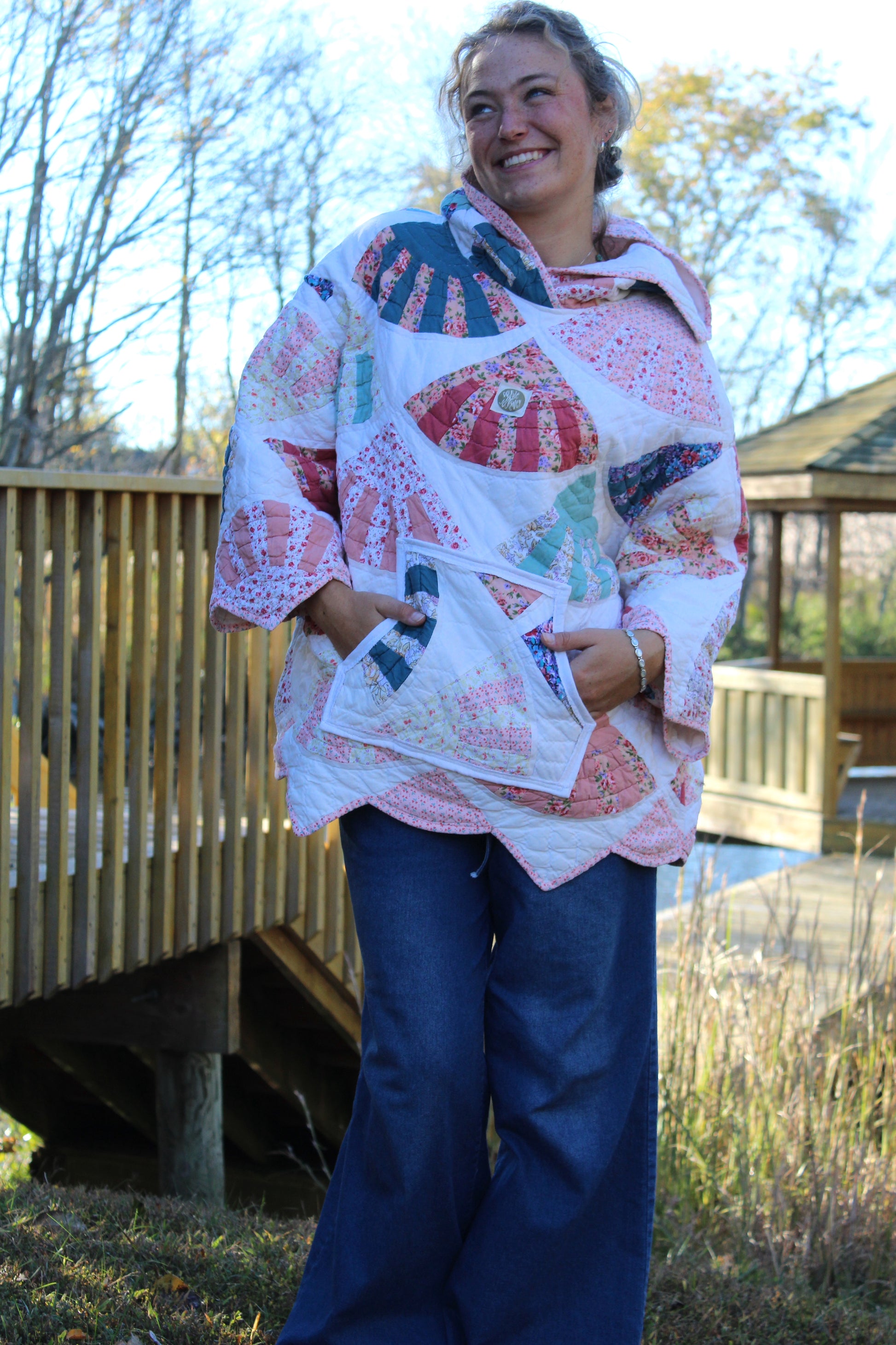 pink hoodie with scalloped details and hood