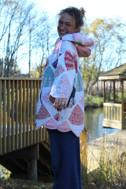 woman wearing vintage quilted hoodie with pink patterns