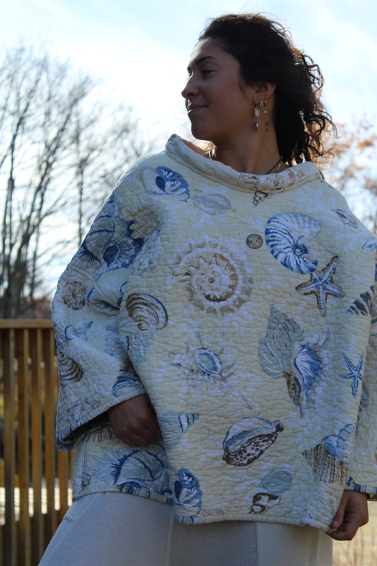 Handmade mockneck crafted from a vintage quilt featuring delicate seashell patterns