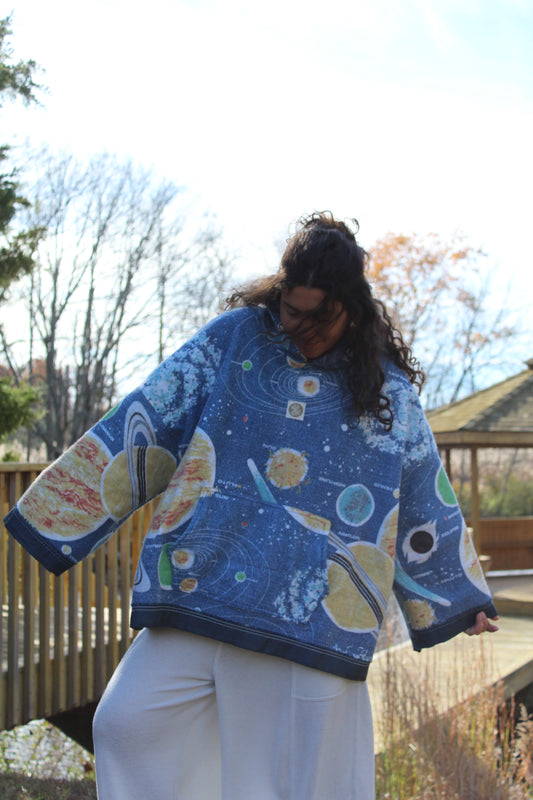 Handmade hoodie crafted from a vintage space-themed blanket featuring stars and planets.