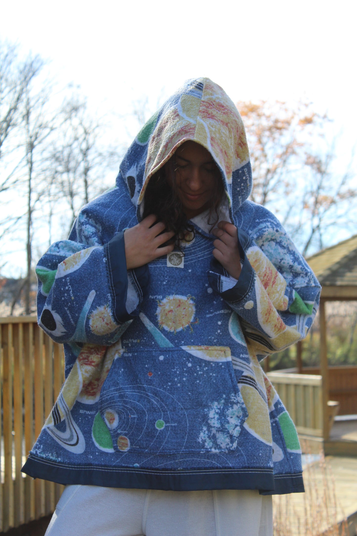 Upcycled hoodie made from cozy space print blanket with celestial designs.