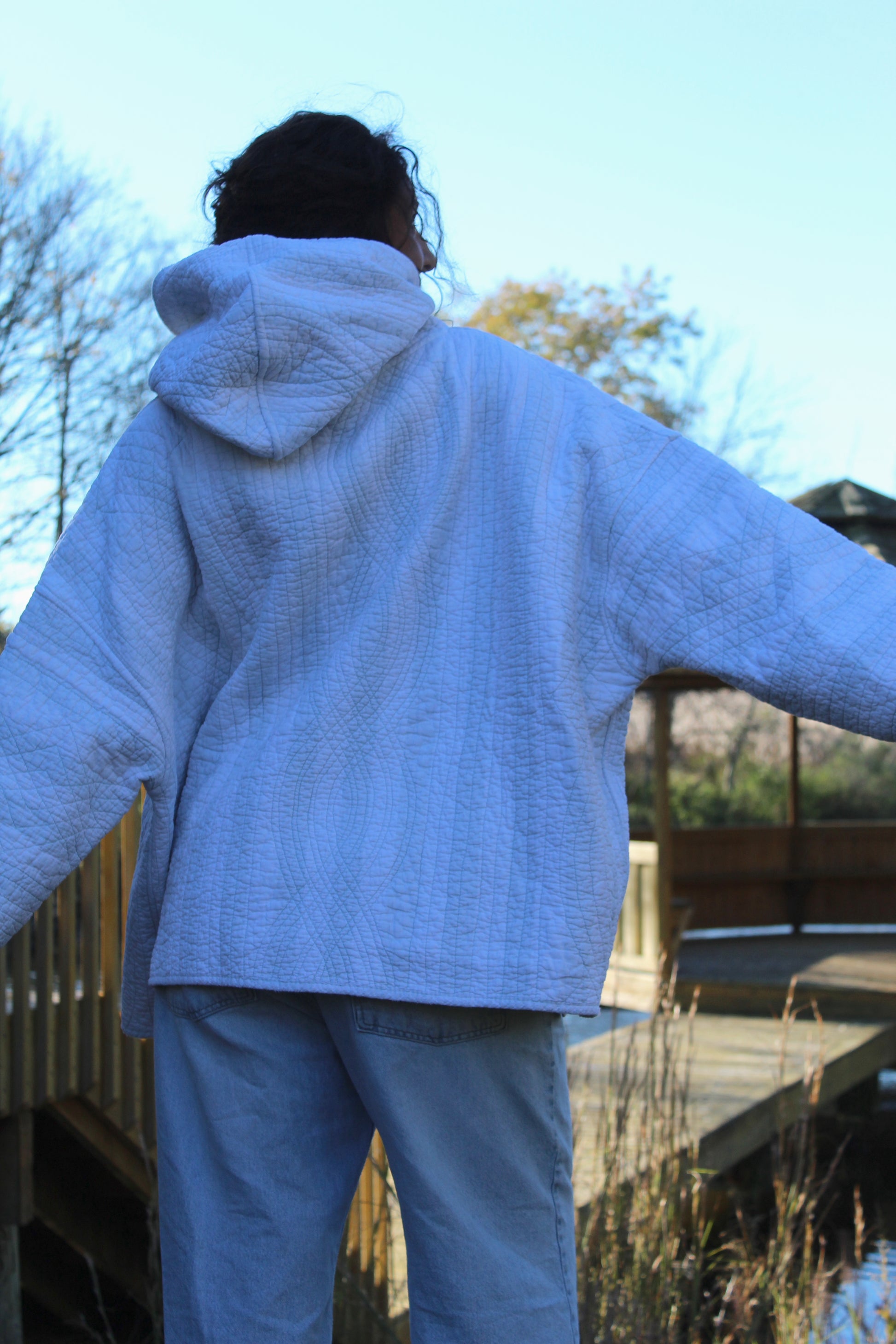 One-of-a-kind vintage quilted hoodie with delicate blue stripes and a floral detail pocket