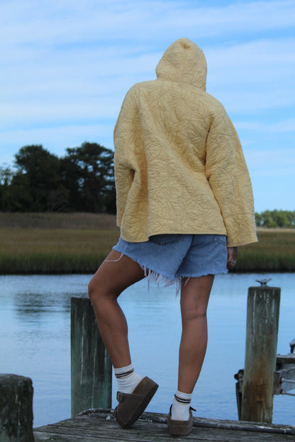 back view of quilted yellow sweatshirt